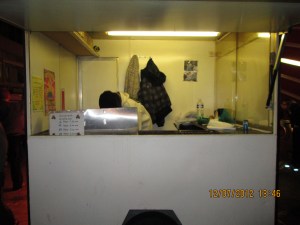 Roasted Chestnut stand...the lady bent down as I took the picture!